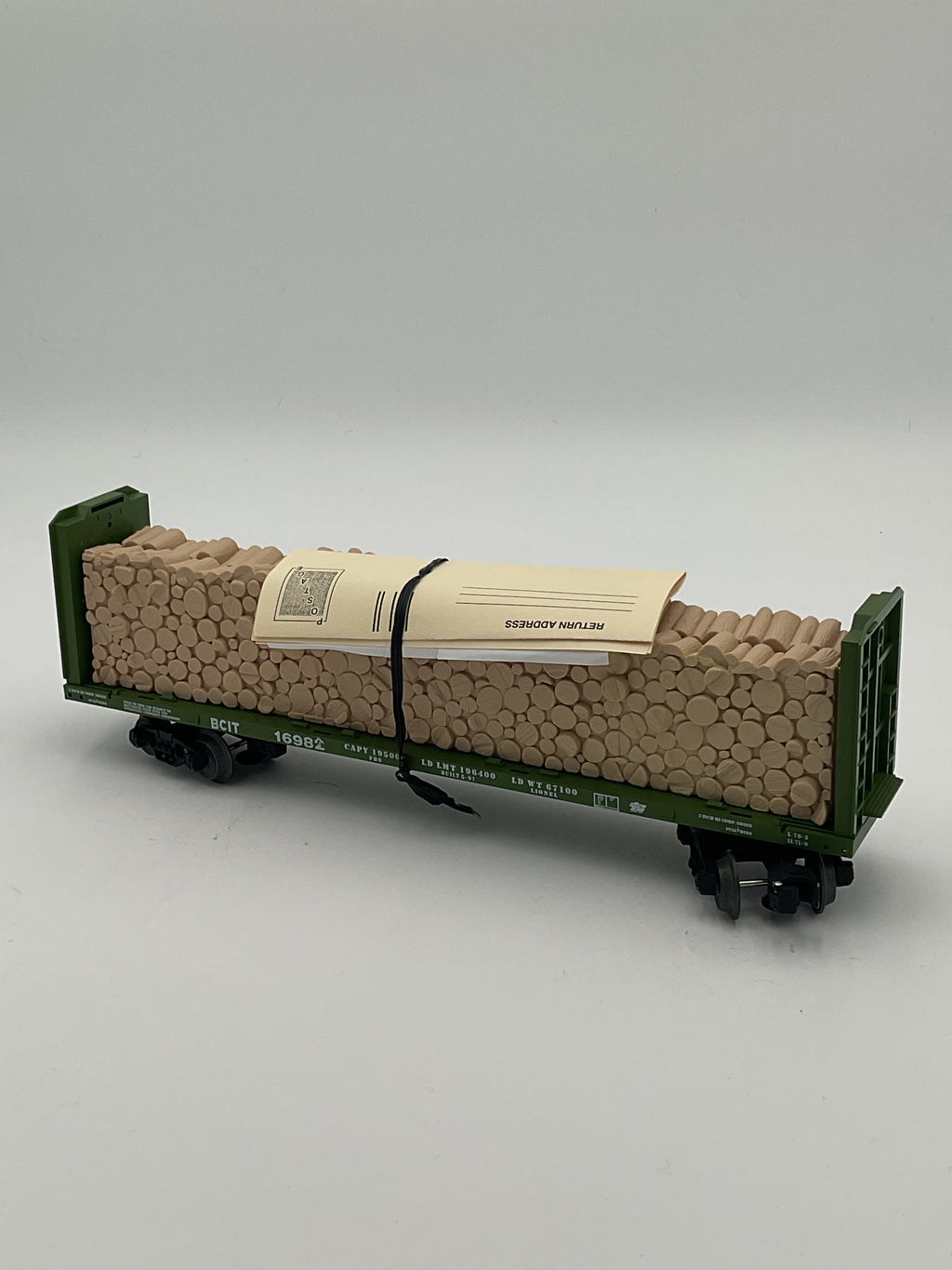 Lionel O 16982 9823 BC Rail Bulkhead Flatcar with Cut Wood Load