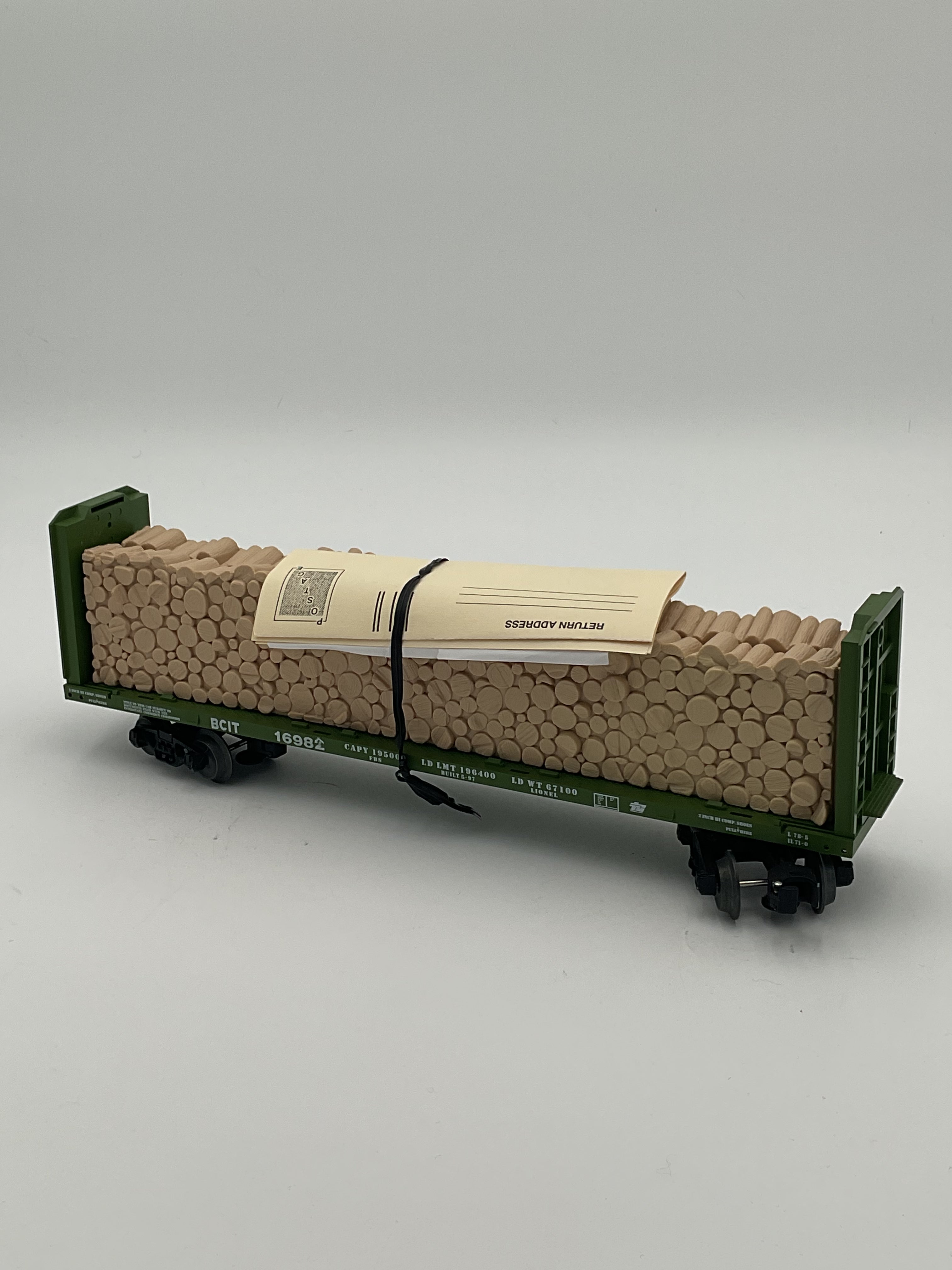Lionel O 16982 9823 BC Rail Bulkhead Flatcar with Cut Wood Load