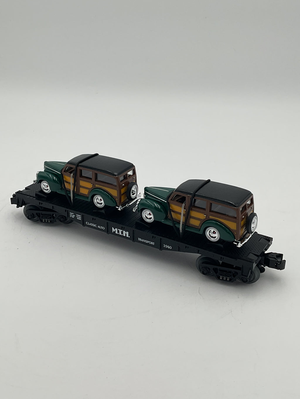 MTH 30-7652 Auto Transport Flatcar w/ Ertl ‘40 Woody Wagons