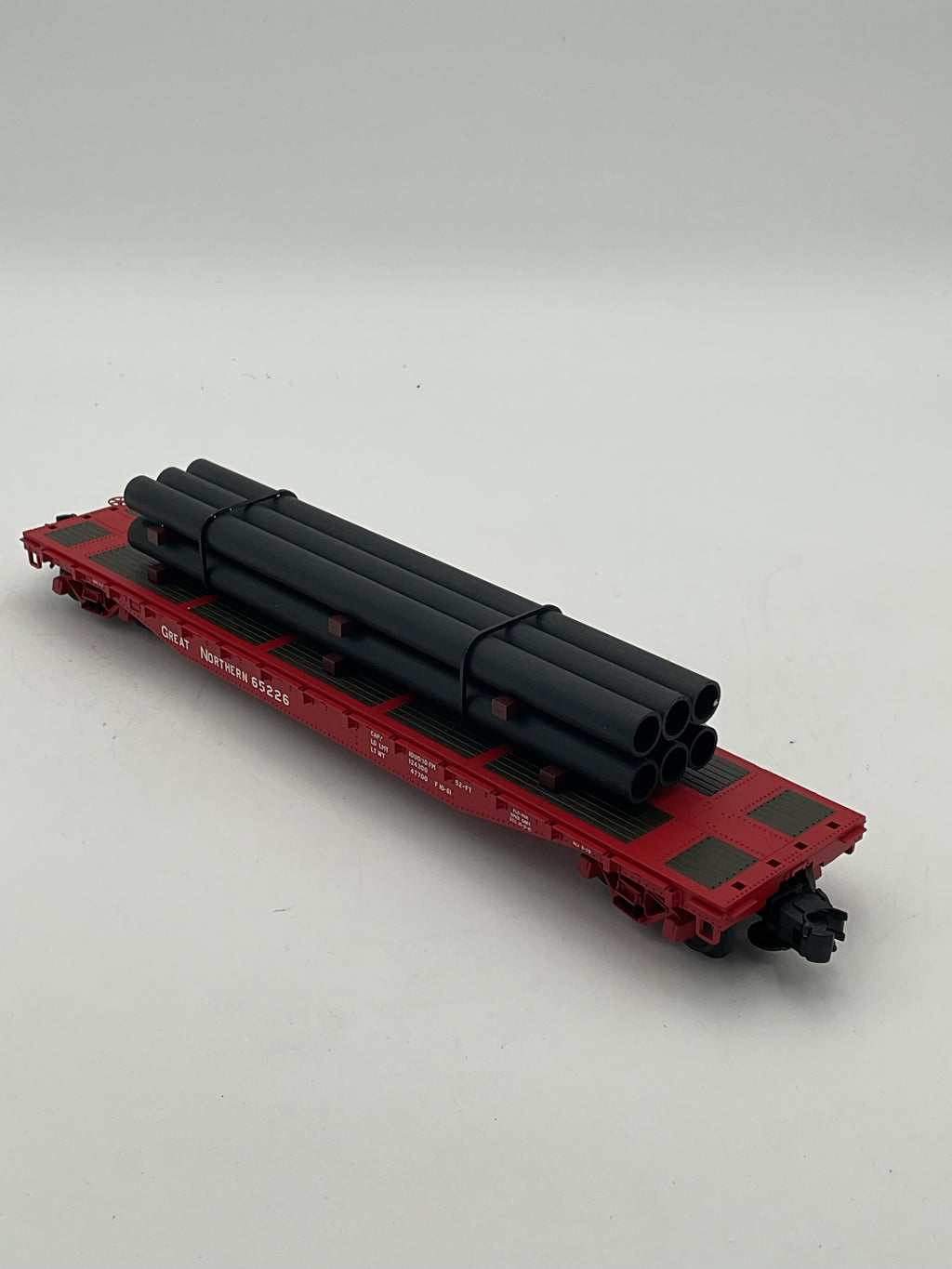 Atlas O 0936-2 Great Northern #65226 O Trainman 52’ 6” Flat Car w/ Pipe Load [3 Rail]